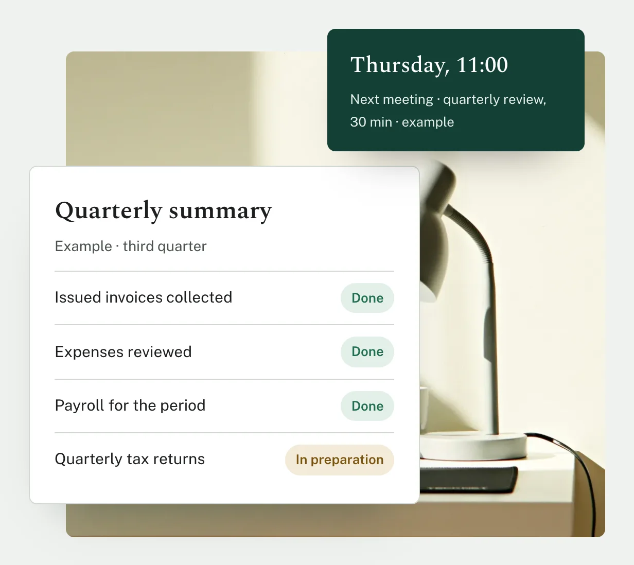 Detail: a photograph of a desk with a sample quarterly summary on top, marking invoices, expenses and payroll as done and the tax returns as in preparation, plus the next meeting.